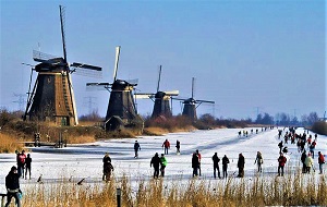 Skating by the Kinderdijk Windmills, Photo by jace48, Wikimedia Commons